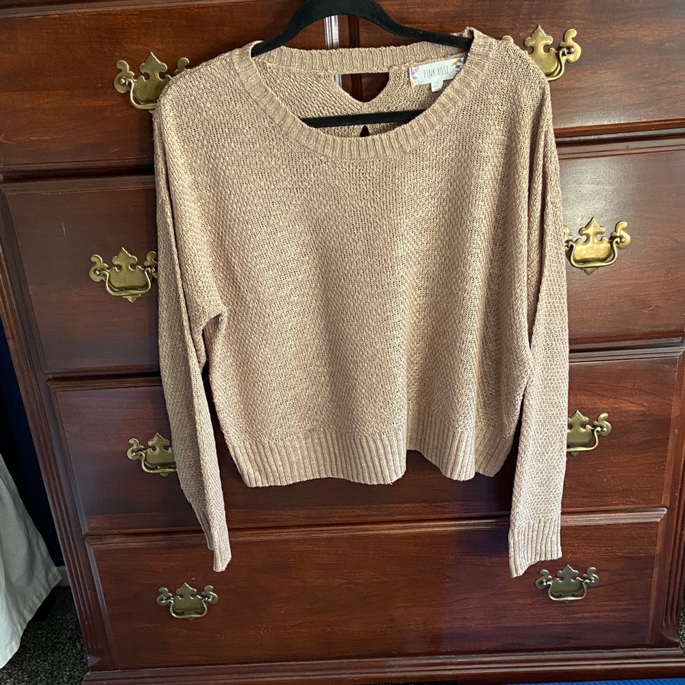 A delicate knit, open-worked back beige sweater.